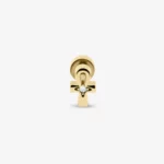 Piercing z białym symbolem ankh